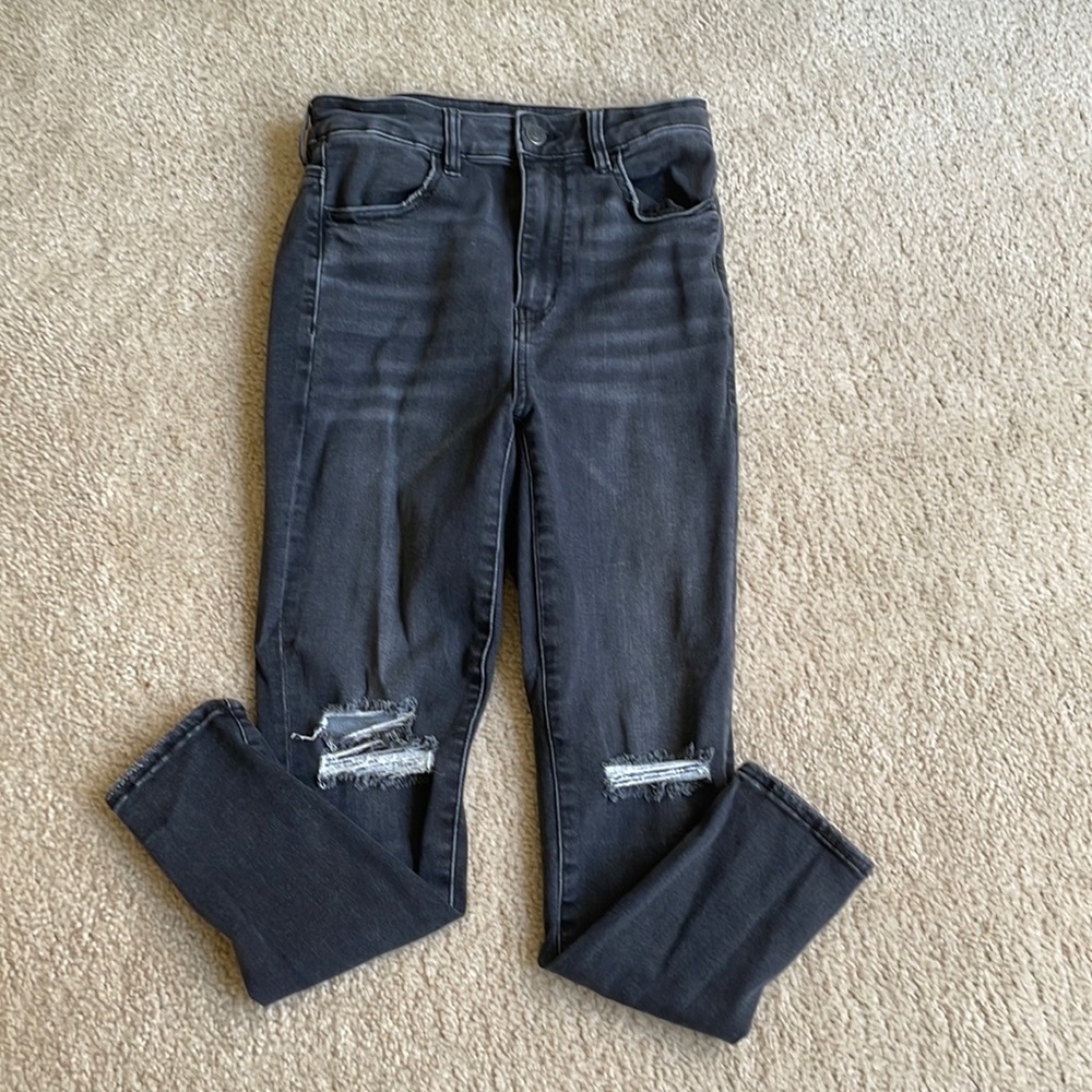 Distressed black skinny jeans